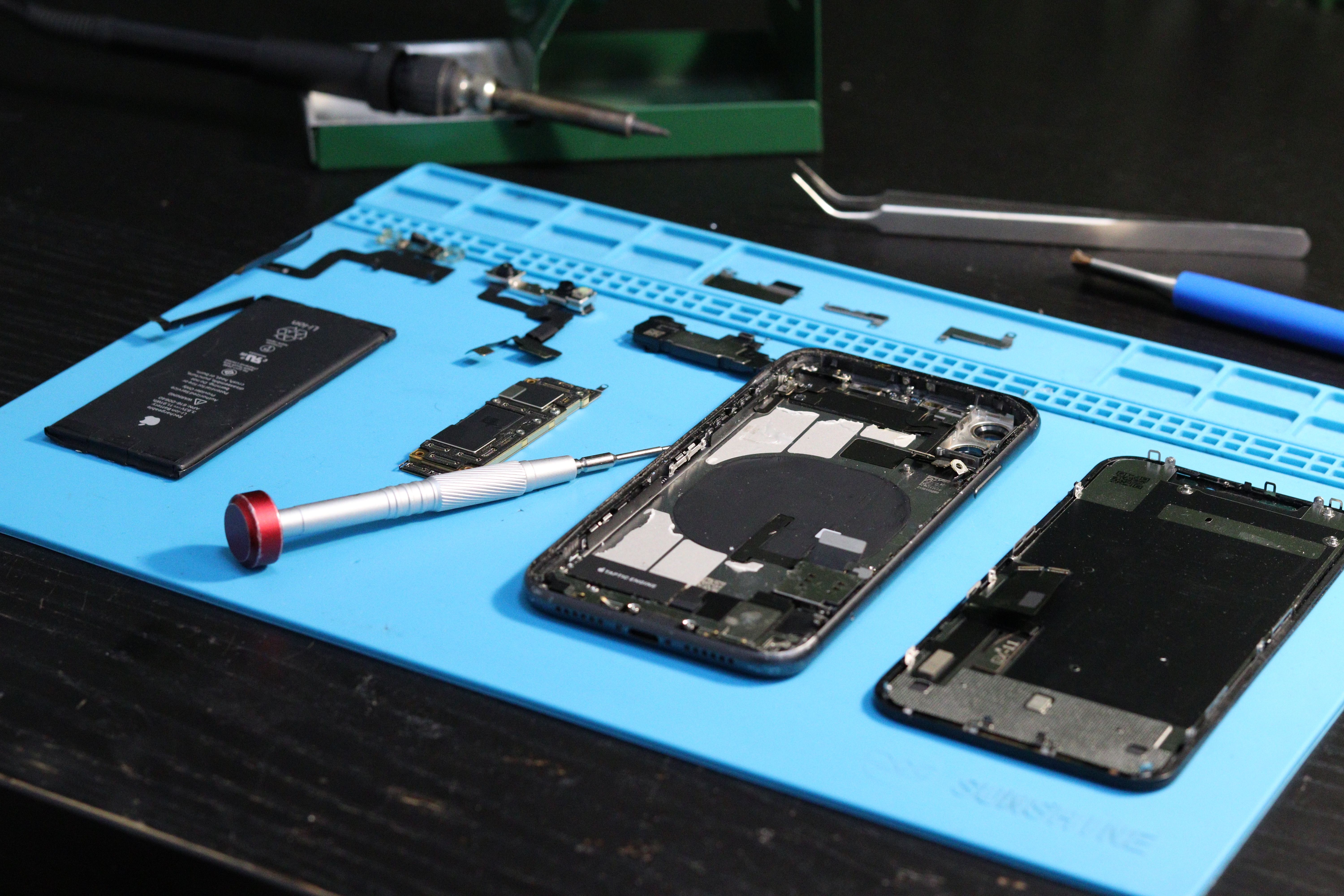Technician diagnosing a device fault